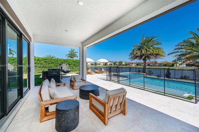 view of patio / terrace featuring a fenced in pool and an outdoor hangout area