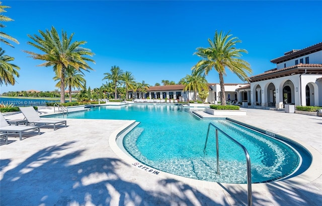 view of swimming pool with a patio area