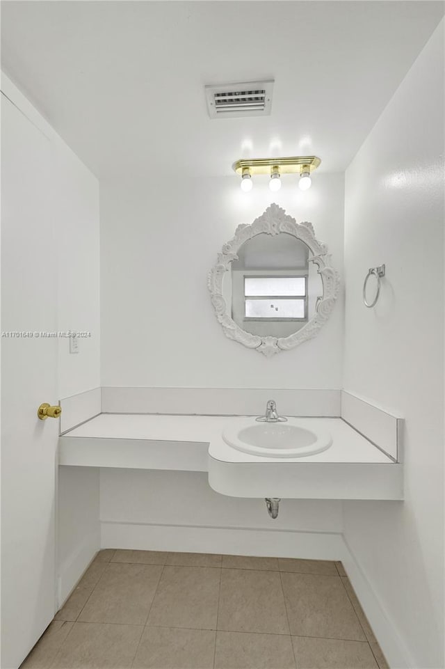 bathroom with tile patterned floors and sink