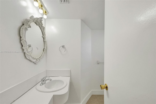 bathroom featuring tile patterned floors and sink