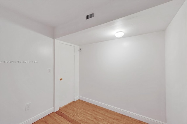 unfurnished room featuring wood-type flooring