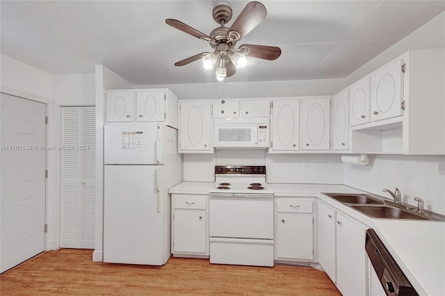 kitchen with white appliances, white cabinetry, light hardwood / wood-style flooring, and sink