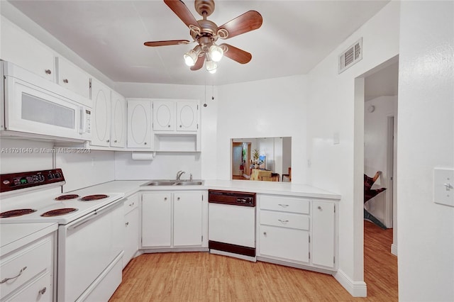 kitchen featuring white cabinetry, white appliances, sink, and light hardwood / wood-style flooring