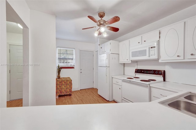 kitchen with white appliances, sink, ceiling fan, light hardwood / wood-style floors, and white cabinetry