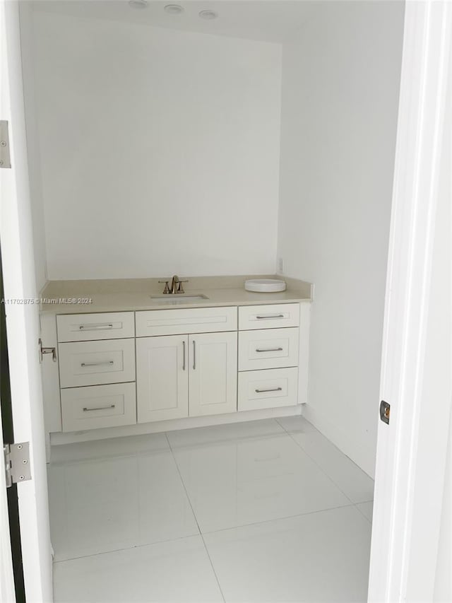 bathroom featuring tile patterned floors and vanity