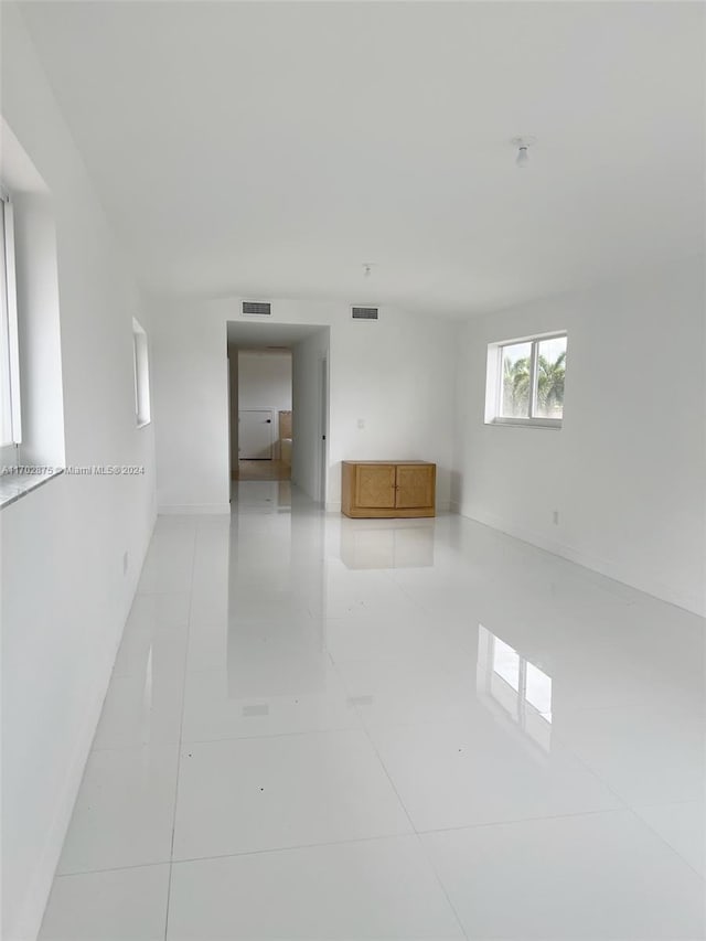 unfurnished room featuring light tile patterned floors