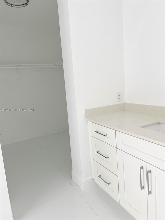 bathroom featuring tile patterned floors and vanity