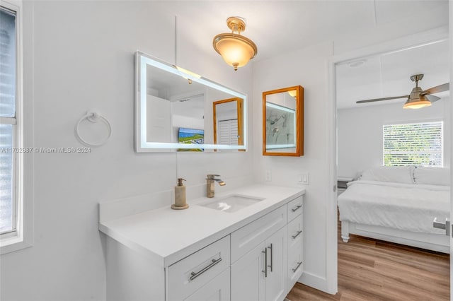 bathroom featuring ceiling fan, vanity, and hardwood / wood-style flooring