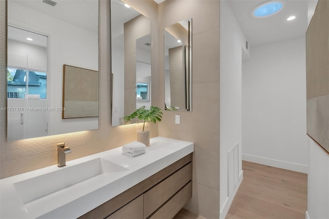 bathroom with vanity and wood-type flooring