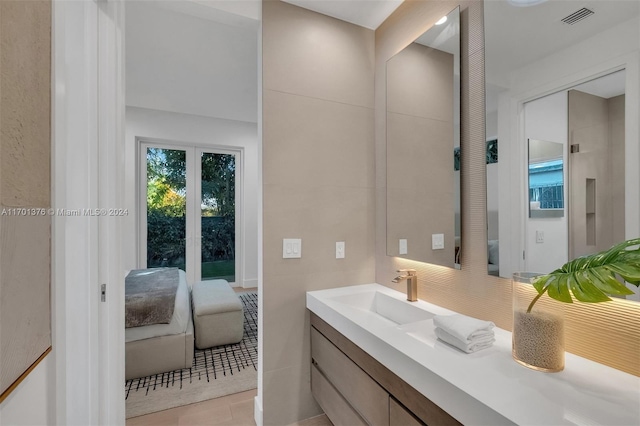 bathroom with tile patterned flooring and vanity