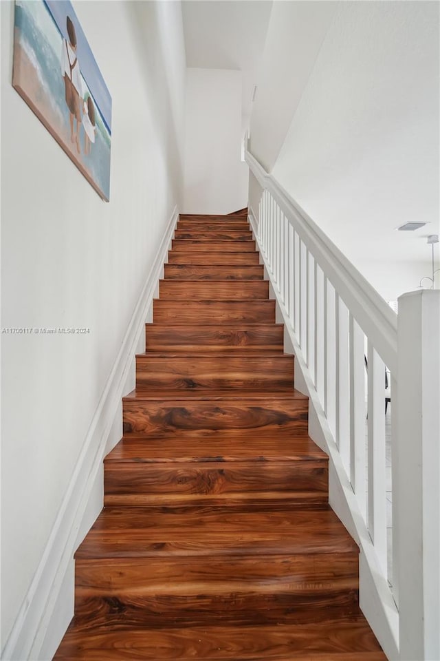 stairway with wood-type flooring