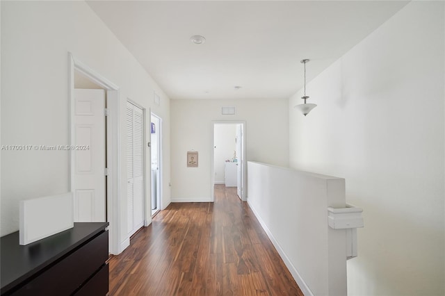 hallway with dark hardwood / wood-style flooring