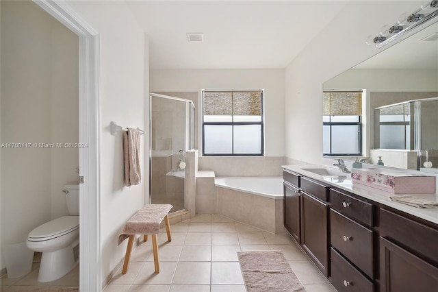 full bathroom featuring tile patterned floors, vanity, toilet, and shower with separate bathtub