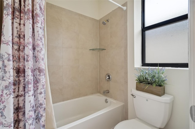 bathroom with shower / bath combination with curtain and toilet