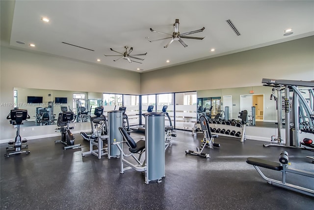 workout area with a high ceiling and ceiling fan