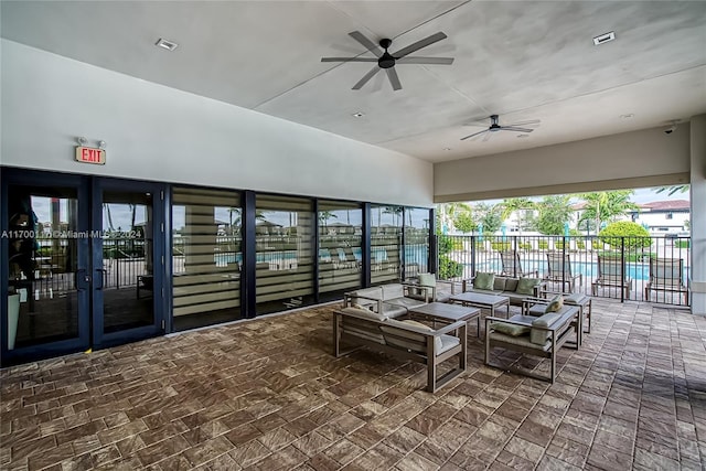 sunroom / solarium with ceiling fan