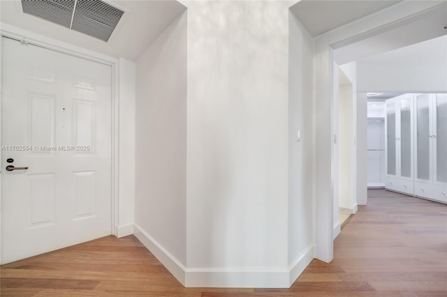 corridor featuring light hardwood / wood-style flooring