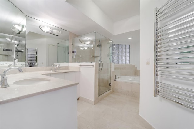 bathroom with shower with separate bathtub and vanity