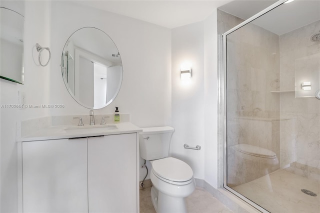 bathroom featuring tile patterned floors, vanity, toilet, and a shower with door