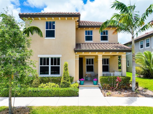 mediterranean / spanish-style house featuring covered porch