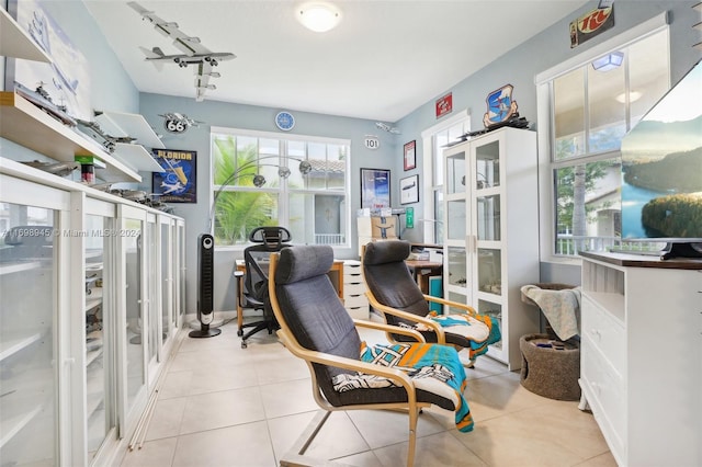 home office featuring rail lighting and light tile patterned flooring