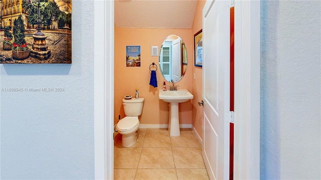 bathroom with tile patterned floors, toilet, and sink