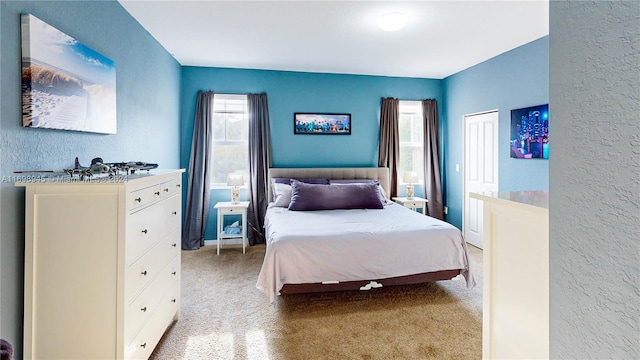 bedroom featuring light colored carpet