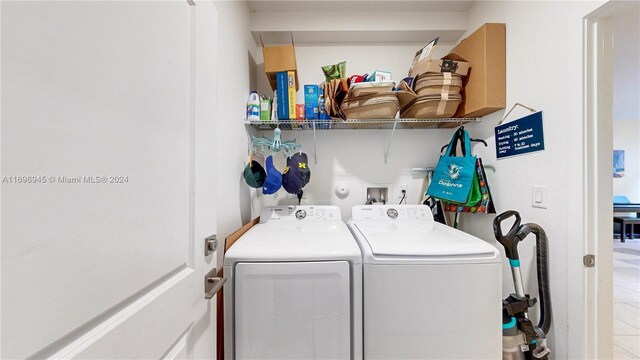 washroom featuring independent washer and dryer