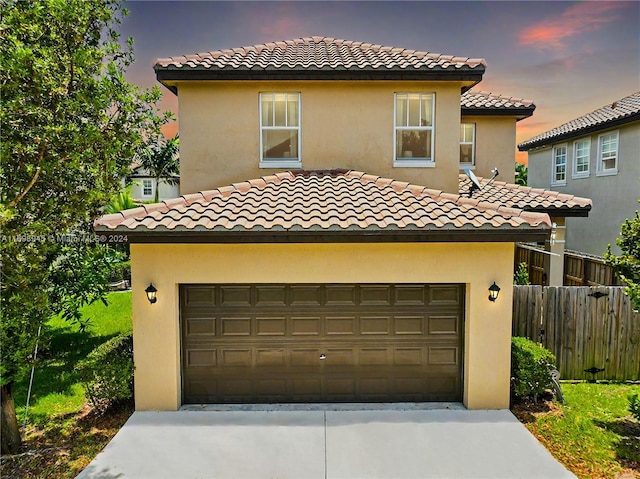 mediterranean / spanish-style house featuring a garage