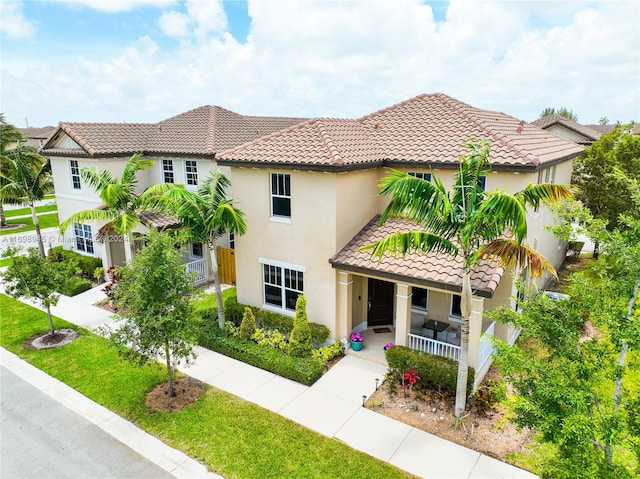 mediterranean / spanish-style house featuring covered porch