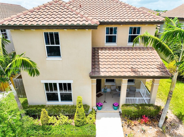 back of property featuring a patio area