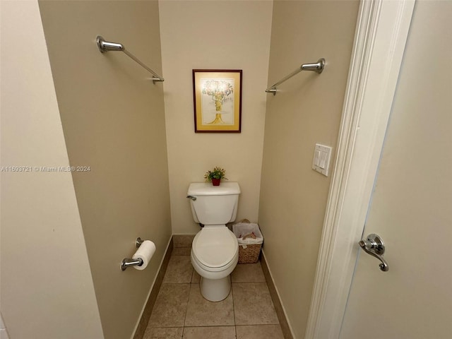 bathroom with tile patterned flooring and toilet