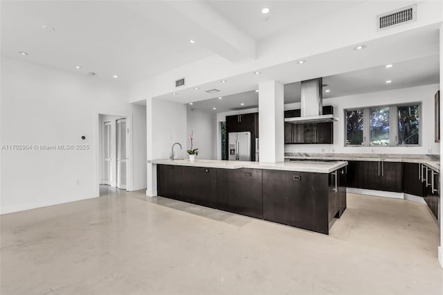 kitchen featuring island exhaust hood, stainless steel fridge with ice dispenser, a center island, beamed ceiling, and dark brown cabinetry