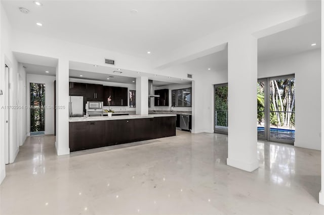 kitchen featuring stainless steel appliances and dark brown cabinets