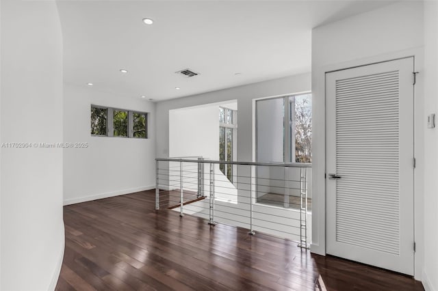 unfurnished room featuring dark hardwood / wood-style floors