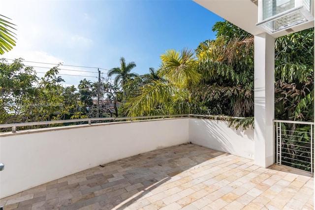 view of patio featuring a balcony