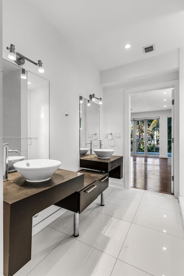 bathroom featuring vanity, breakfast area, and tile patterned floors