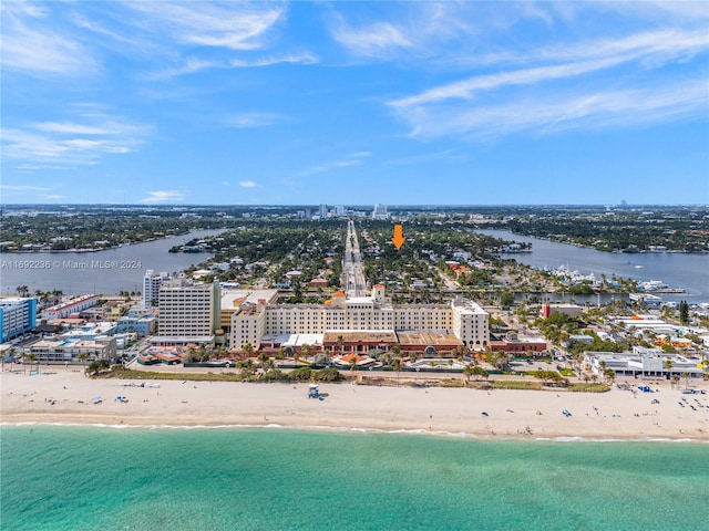 drone / aerial view with a view of the beach and a water view