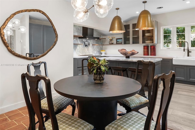 dining area with recessed lighting, baseboards, and light wood-style floors