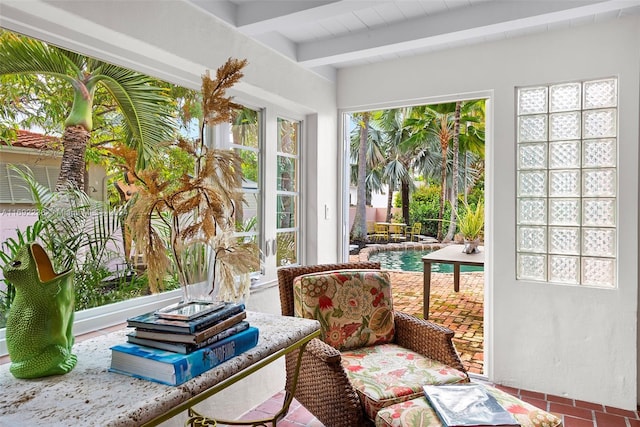 sunroom / solarium with beamed ceiling and plenty of natural light