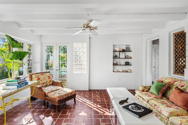 sunroom / solarium with beamed ceiling, french doors, ceiling fan, and wood ceiling