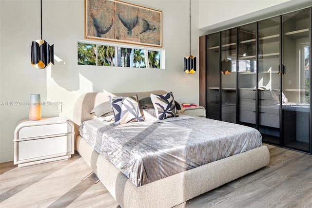 bedroom with wood finished floors