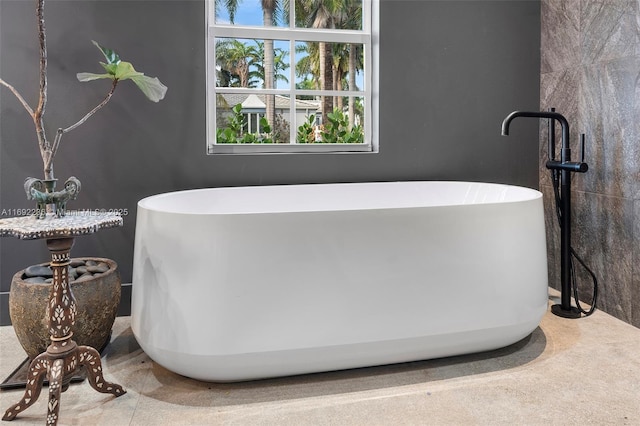 full bathroom featuring a freestanding tub