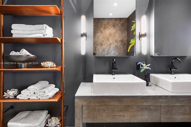 full bath with double vanity and a sink