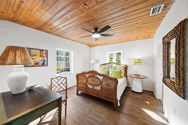 bedroom featuring visible vents, multiple windows, and vaulted ceiling