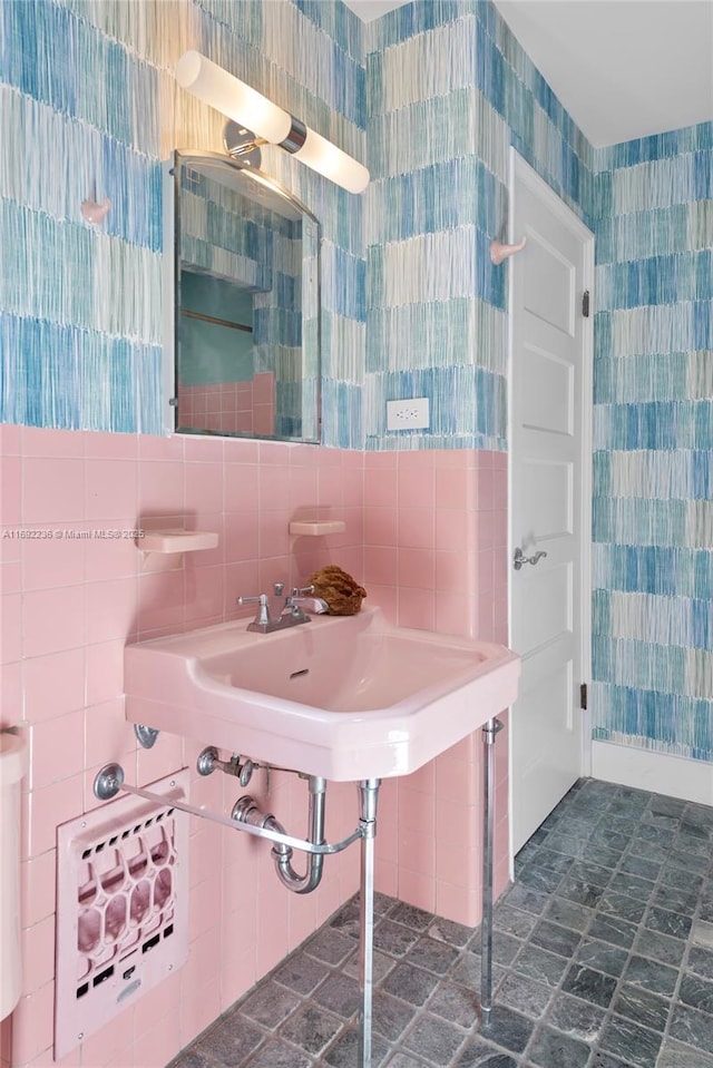 bathroom with tile walls