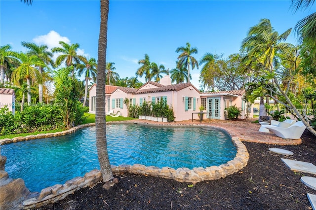 pool featuring french doors