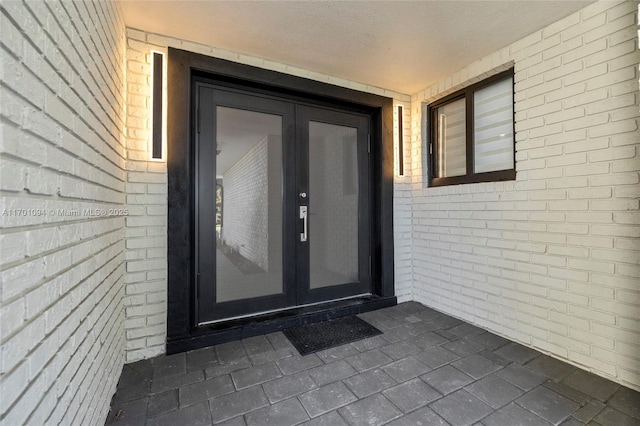 doorway to property featuring french doors