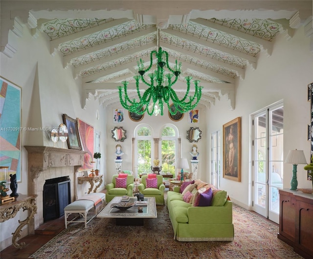 living room with plenty of natural light, beamed ceiling, and high vaulted ceiling