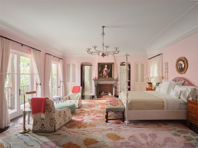 bedroom with access to outside and a notable chandelier